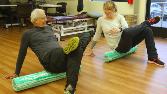 senior and woman doing physical therapy - outpatient services